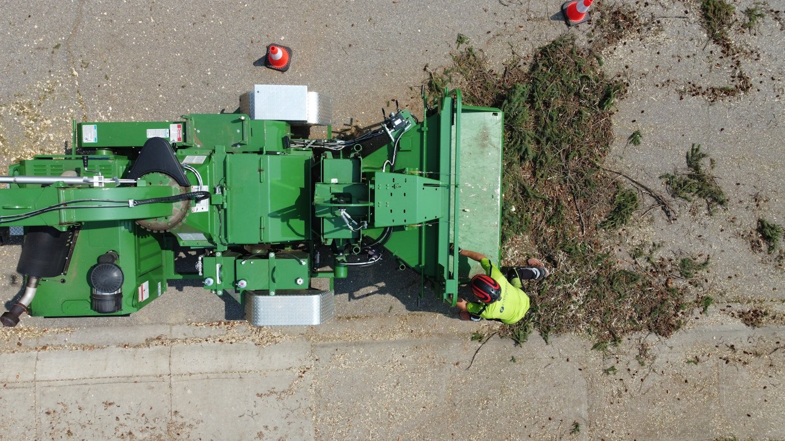 Wood chipper processing brush and limbs during a Tallahassee tree debris removal job