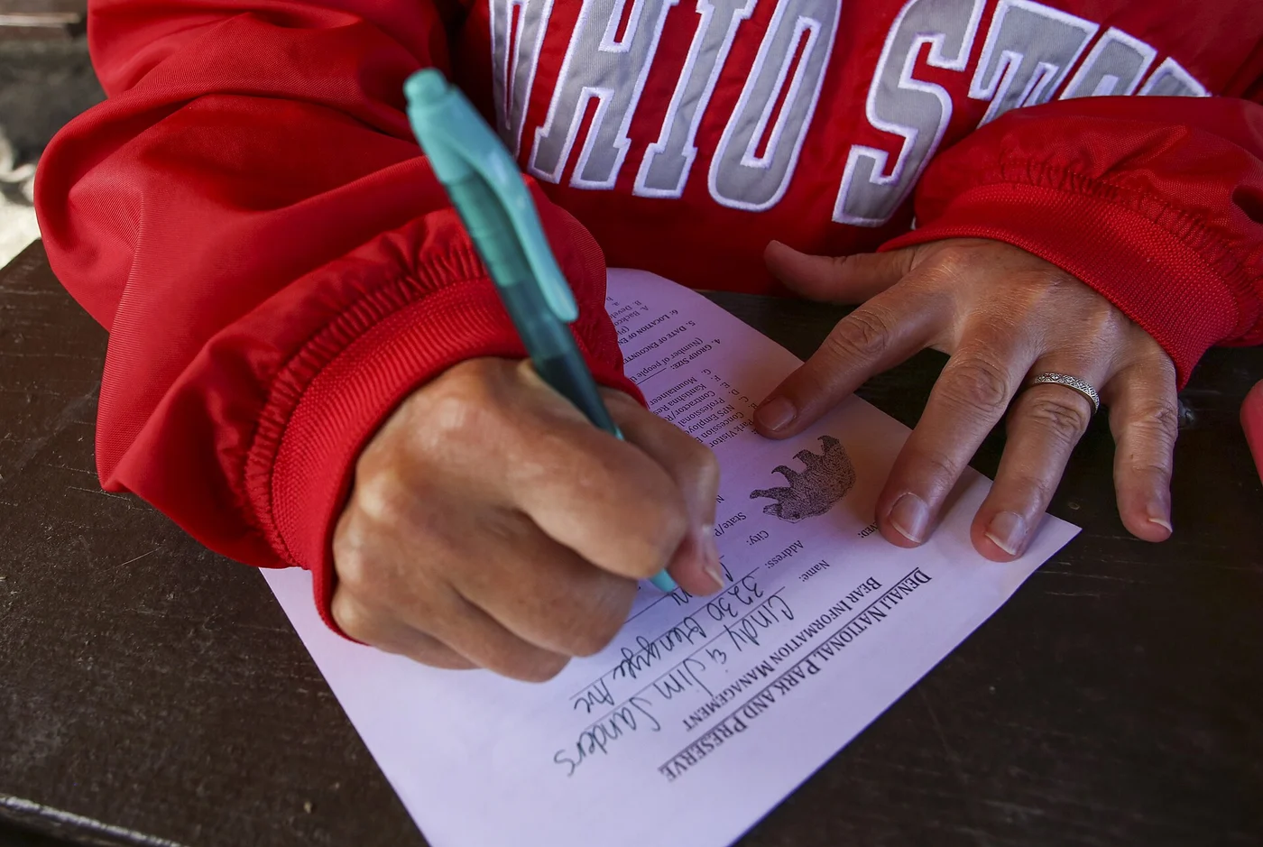 How to Read a Tree Service Estimate — Red Flags to Watch For - Tallahassee Tree Service Hand marking up a written estimate, the line-by-line scope check before approving tree work in Tallahassee, FL